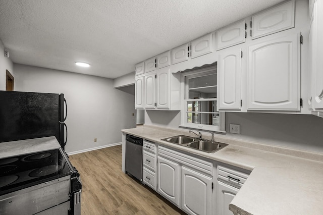 8235 Nicollet Ave S, Bloomington, MN 55420 - kitchen featuring a sink, stainless steel dishwasher, freestanding refrigerator, range with electric cooktop, and white cabinets