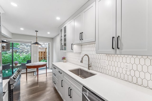 4584 Cedar Lake Rd S Unit 1, Saint Louis Park, MN 55416 - kitchen featuring appliances with stainless steel finishes, a baseboard heating unit, light countertops, white cabinets, and recessed lighting