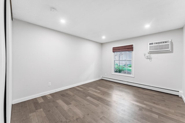 4584 Cedar Lake Rd S Unit 1, Saint Louis Park, MN 55416 - spare room with a baseboard heating unit, a wall mounted air conditioner, wood finished floors, and recessed lighting