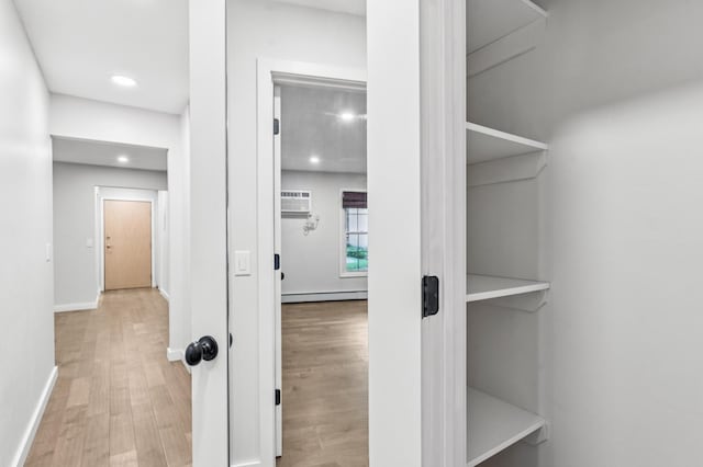 4584 Cedar Lake Rd S Unit 1, Saint Louis Park, MN 55416 - closet with a baseboard radiator and an AC wall unit