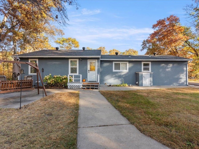 5335 Pine Beach Rd, Brainerd, MN 56401 - ranch-style home featuring a front yard, a patio area, and roof with shingles