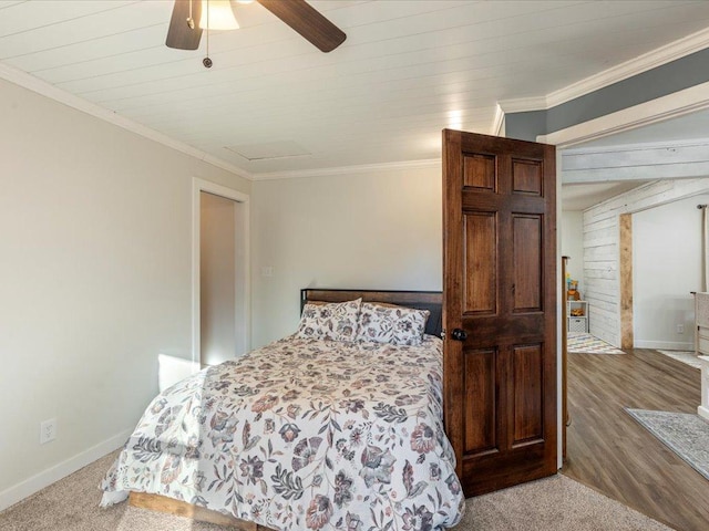 5335 Pine Beach Rd, Brainerd, MN 56401 - bedroom with wooden walls, baseboards, crown molding, attic access, and ceiling fan