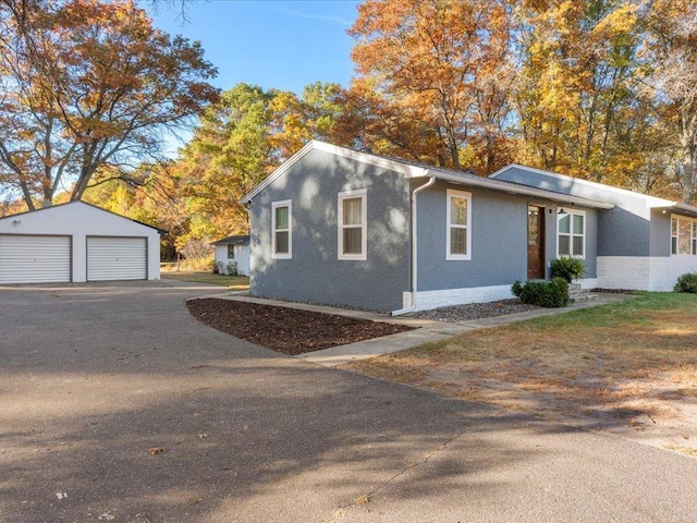 5335 Pine Beach Rd, Brainerd, MN 56401 - view of front of home featuring a detached garage and an outdoor structure