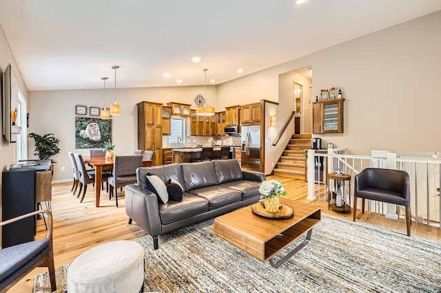 5691 Birch Trl, Shoreview, MN 55126 - living area with light wood-style floors, recessed lighting, lofted ceiling, baseboards, and stairs