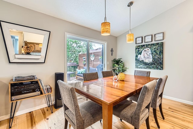 5691 Birch Trl, Shoreview, MN 55126 - dining area with light wood-type flooring, baseboards, and vaulted ceiling