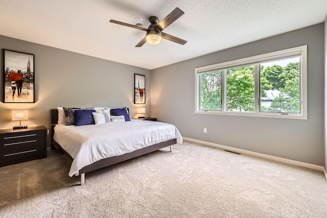 5691 Birch Trl, Shoreview, MN 55126 - carpeted bedroom featuring baseboards, a textured ceiling, and ceiling fan