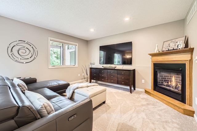 5691 Birch Trl, Shoreview, MN 55126 - living area with light carpet, recessed lighting, a textured ceiling, a glass covered fireplace, and baseboards