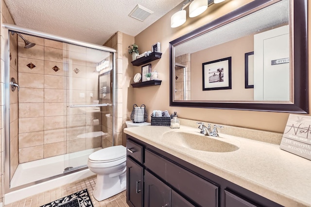 5691 Birch Trl, Shoreview, MN 55126 - full bathroom featuring vanity, toilet, a textured ceiling, a stall shower, and tile patterned floors
