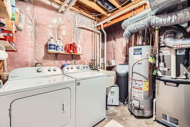 5691 Birch Trl, Shoreview, MN 55126 - laundry area with washer and clothes dryer and gas water heater