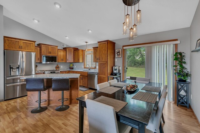 823 Morningside Loop, Saint Joseph, MN 56374 - dining area with lofted ceiling, healthy amount of natural light, light wood finished floors, and recessed lighting