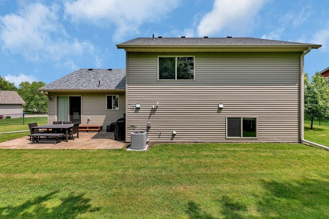 823 Morningside Loop, Saint Joseph, MN 56374 - back of property featuring a patio, a lawn, and a shingled roof