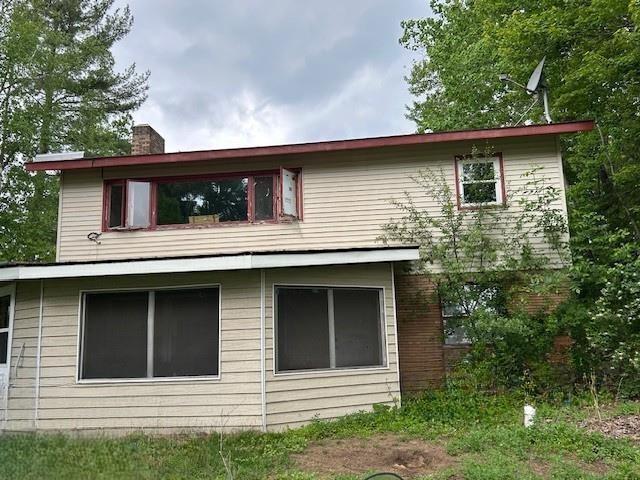 31074 State Highway 65, Greenway Twp, MN 55775 - view of side of home with a chimney
