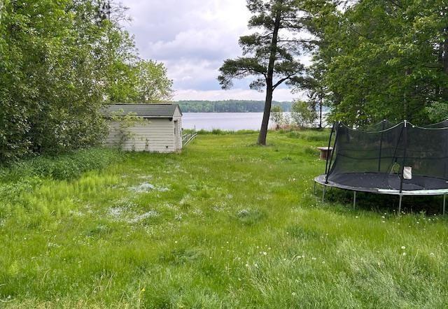 31074 State Highway 65, Greenway Twp, MN 55775 - view of yard featuring a trampoline and a water view
