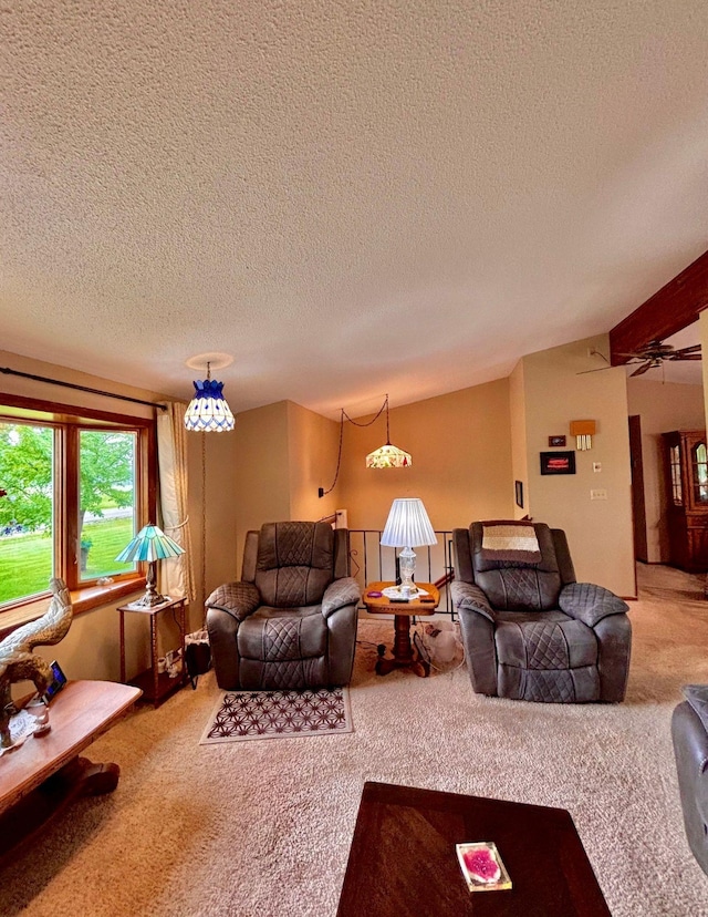 4488 Konieska Rd, Moose Lake, MN 55767 - carpeted living room featuring a textured ceiling, vaulted ceiling, and a ceiling fan