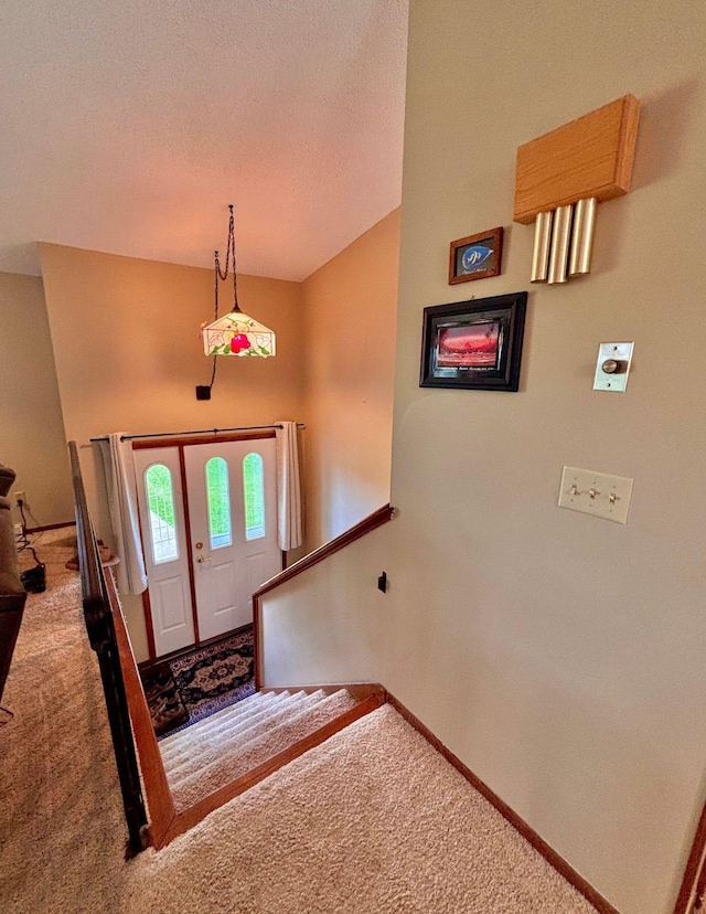 4488 Konieska Rd, Moose Lake, MN 55767 - carpeted foyer entrance featuring baseboards and a textured ceiling