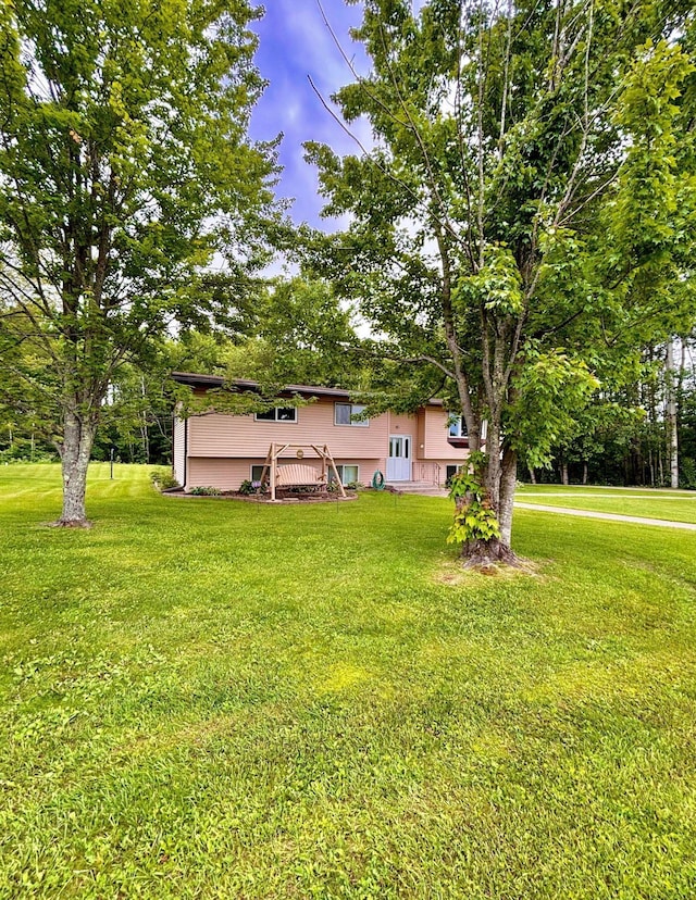 4488 Konieska Rd, Moose Lake, MN 55767 - view of green lawn with a wooden deck