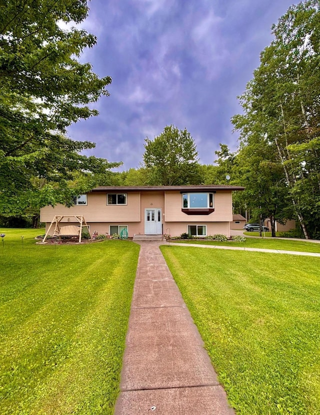 4488 Konieska Rd, Moose Lake, MN 55767 - split foyer home featuring a front lawn and french doors