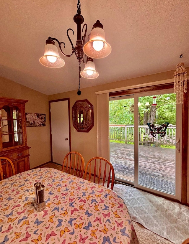 4488 Konieska Rd, Moose Lake, MN 55767 - dining space with a textured ceiling, carpet, and lofted ceiling