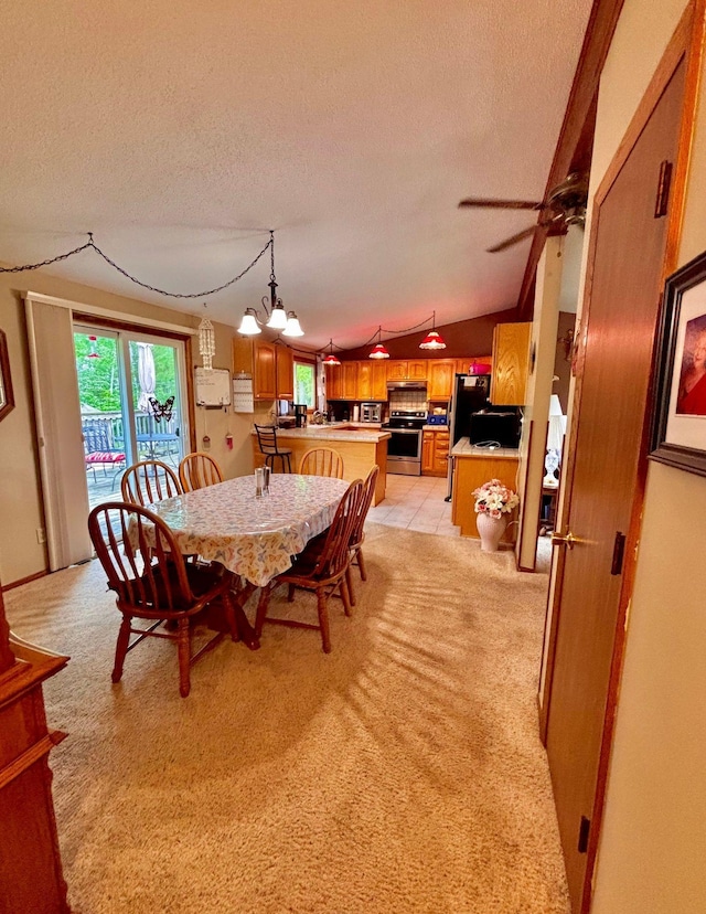 4488 Konieska Rd, Moose Lake, MN 55767 - dining area featuring a textured ceiling, light colored carpet, a chandelier, ceiling fan, and lofted ceiling