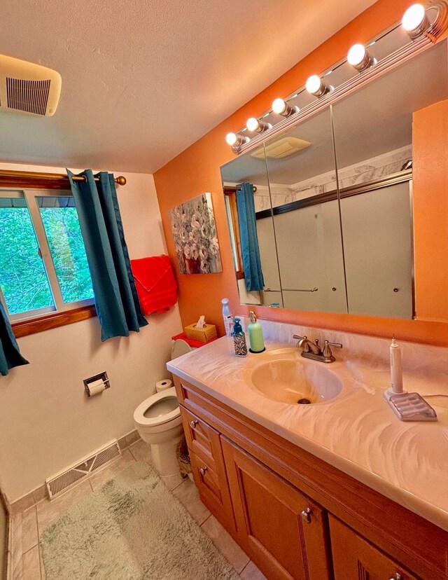 4488 Konieska Rd, Moose Lake, MN 55767 - full bathroom featuring tile patterned flooring, vanity, a shower stall, and a textured ceiling