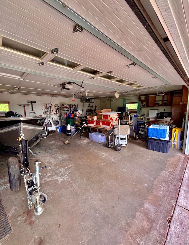 4488 Konieska Rd, Moose Lake, MN 55767 - garage featuring a workshop area and a garage door opener