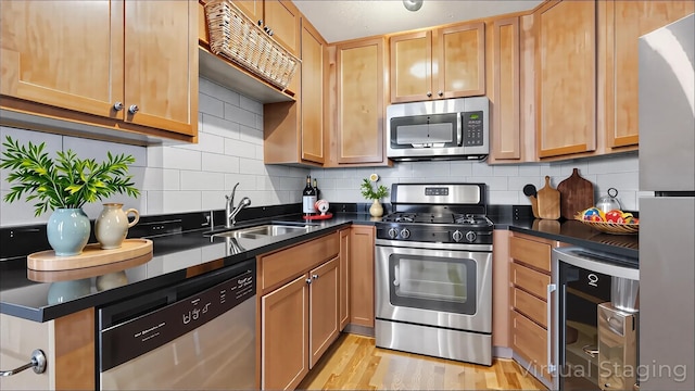 3540 Hennepin Ave Unit 309, Minneapolis, MN 55408 - kitchen with stainless steel appliances, wine cooler, a sink, and dark countertops