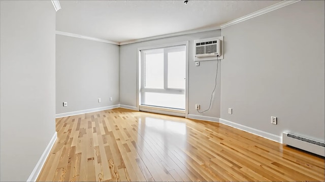 3540 Hennepin Ave Unit 309, Minneapolis, MN 55408 - unfurnished room featuring light wood-style flooring, ornamental molding, baseboards, a baseboard radiator, and a wall mounted air conditioner