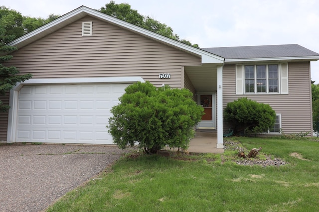 7971 Upper 145th St W, Apple Valley, MN 55124 - view of front facade featuring asphalt driveway, a front lawn, and a garage