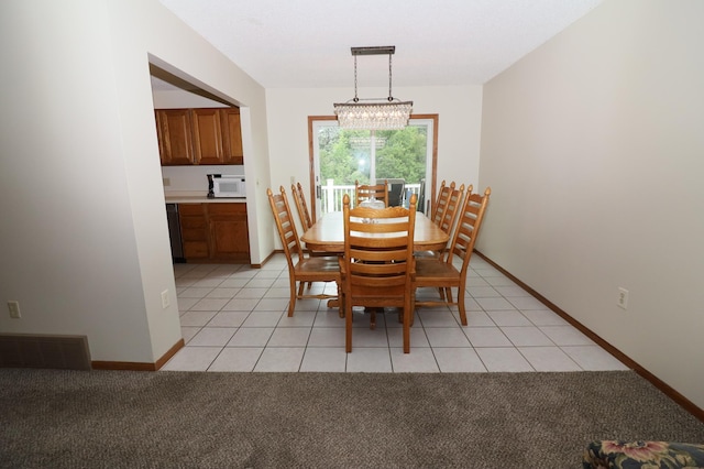 7971 Upper 145th St W, Apple Valley, MN 55124 - dining room featuring a chandelier, light colored carpet, and light tile patterned floors
