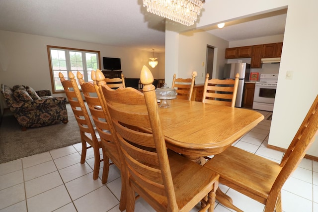 7971 Upper 145th St W, Apple Valley, MN 55124 - dining room with a chandelier, light tile patterned flooring, and light carpet