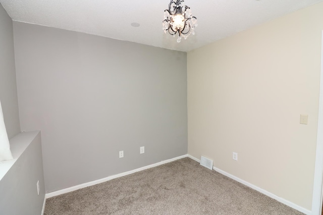 7971 Upper 145th St W, Apple Valley, MN 55124 - carpeted spare room with a chandelier and baseboards