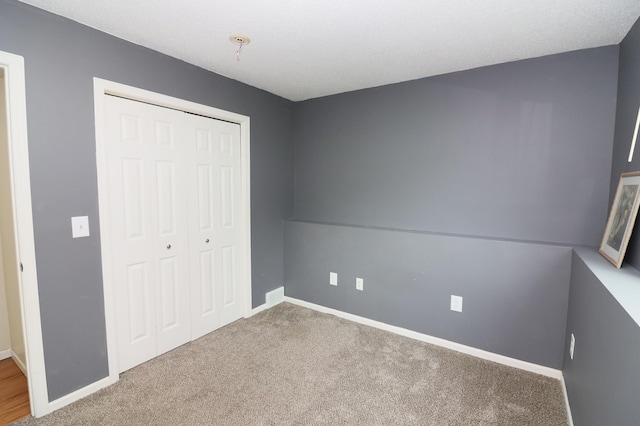 7971 Upper 145th St W, Apple Valley, MN 55124 - unfurnished bedroom with a closet and carpet flooring
