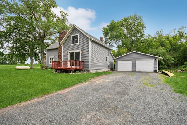2256 40th Ave Unit X, East Farmington, WI 54020 - view of front facade with a chimney, an outdoor structure, a garage, and a front lawn