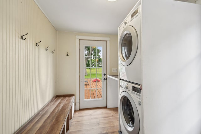 2256 40th Ave Unit X, East Farmington, WI 54020 - washroom with stacked washer / dryer and light wood-style flooring