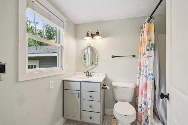 2256 40th Ave Unit X, East Farmington, WI 54020 - full bathroom featuring baseboards, vanity, toilet, tile patterned flooring, and shower / bath combo