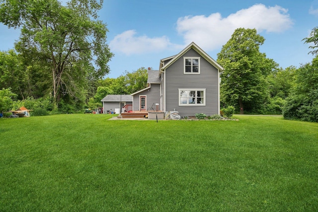 2256 40th Ave Unit X, East Farmington, WI 54020 - rear view of property featuring a deck and a yard
