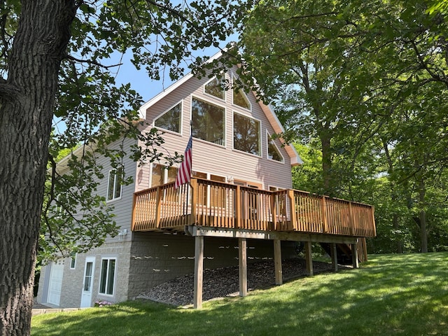 32813 Whispering Springs Loop, Erhard, MN 56534 - back of house with a deck and a yard