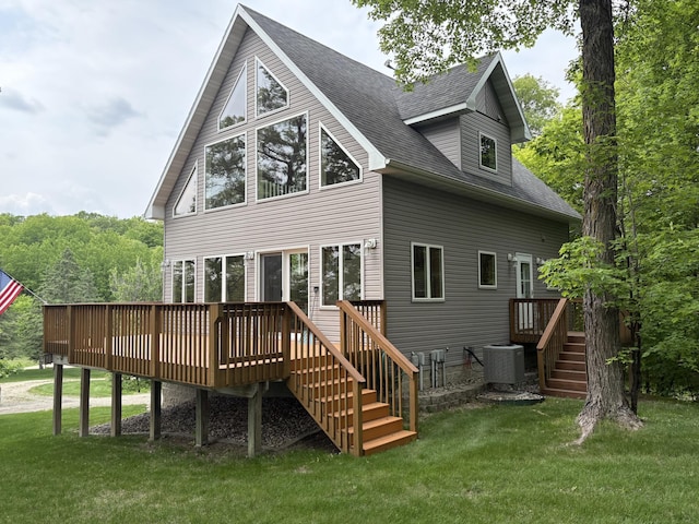 32813 Whispering Springs Loop, Erhard, MN 56534 - back of house with roof with shingles, a wooden deck, a lawn, and stairway