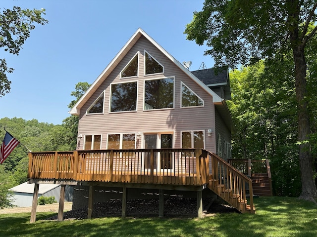 32813 Whispering Springs Loop, Erhard, MN 56534 - back of property with a lawn, a deck, and stairs
