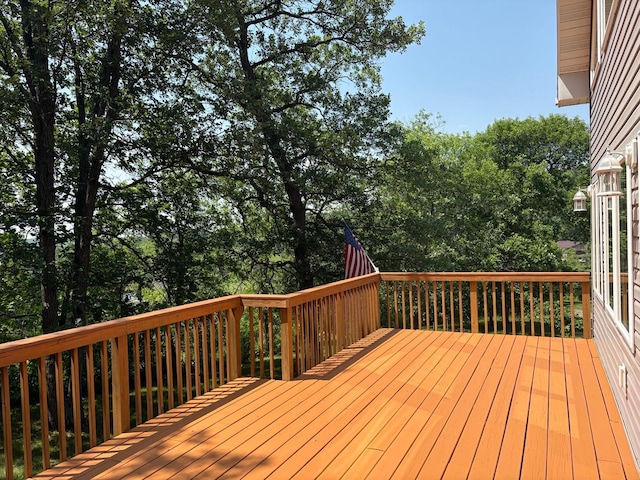 32813 Whispering Springs Loop, Erhard, MN 56534 - wooden deck featuring view of scattered trees