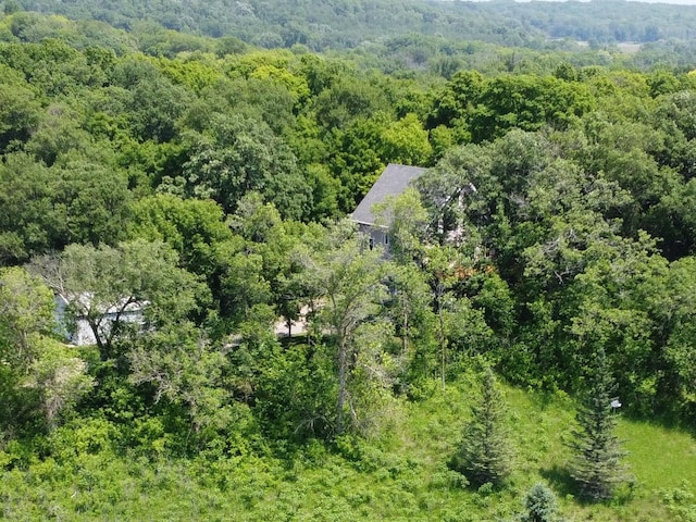 32813 Whispering Springs Loop, Erhard, MN 56534 - aerial view of property and surrounding area with a heavily wooded area