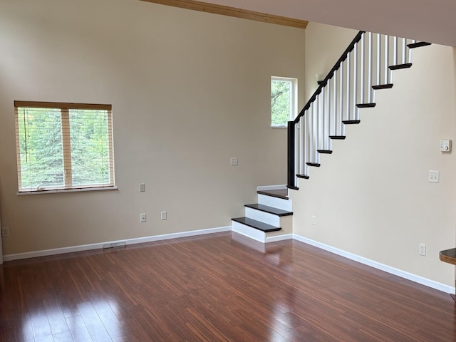 32813 Whispering Springs Loop, Erhard, MN 56534 - staircase featuring wood finished floors and baseboards