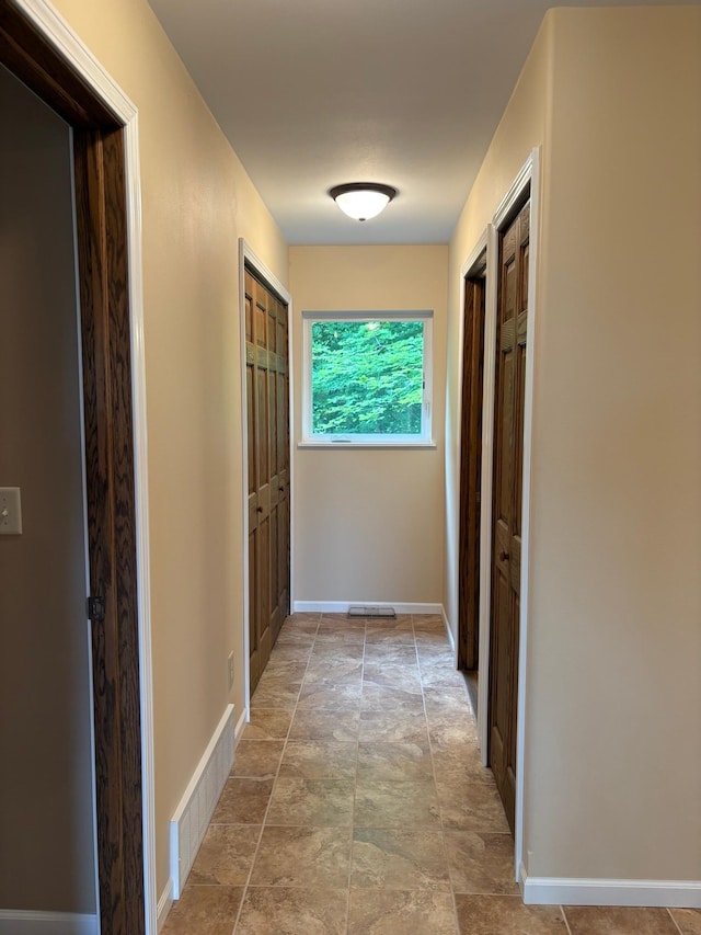 32813 Whispering Springs Loop, Erhard, MN 56534 - corridor with stone finish floors and baseboards
