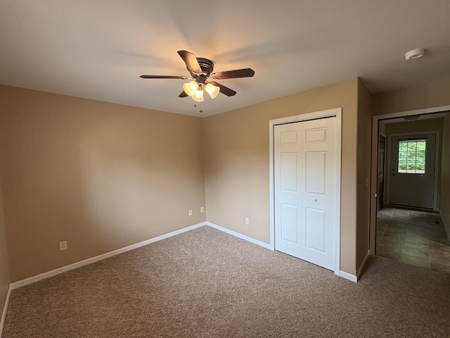 32813 Whispering Springs Loop, Erhard, MN 56534 - unfurnished bedroom featuring carpet flooring, a closet, and a ceiling fan