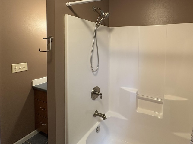 32813 Whispering Springs Loop, Erhard, MN 56534 - bathroom with bathtub / shower combination, vanity, and tile patterned floors