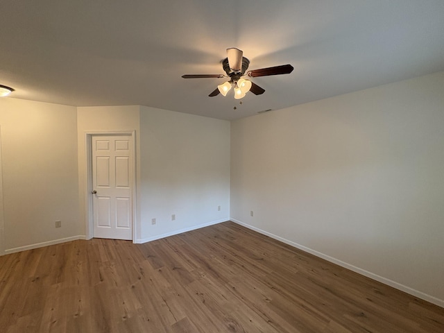 32813 Whispering Springs Loop, Erhard, MN 56534 - empty room with wood finished floors and a ceiling fan