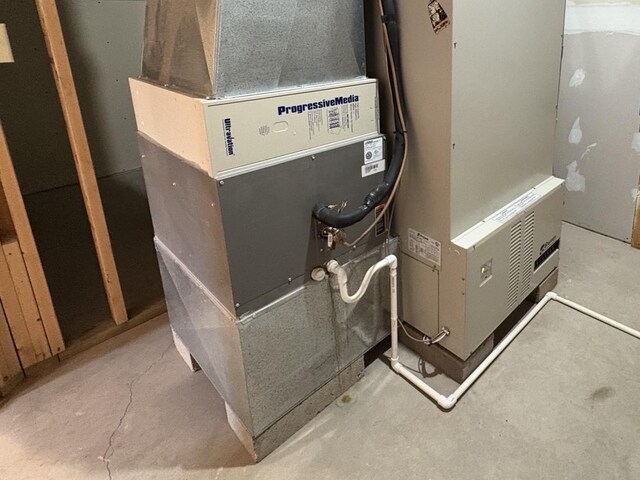 32813 Whispering Springs Loop, Erhard, MN 56534 - utility room with heating unit