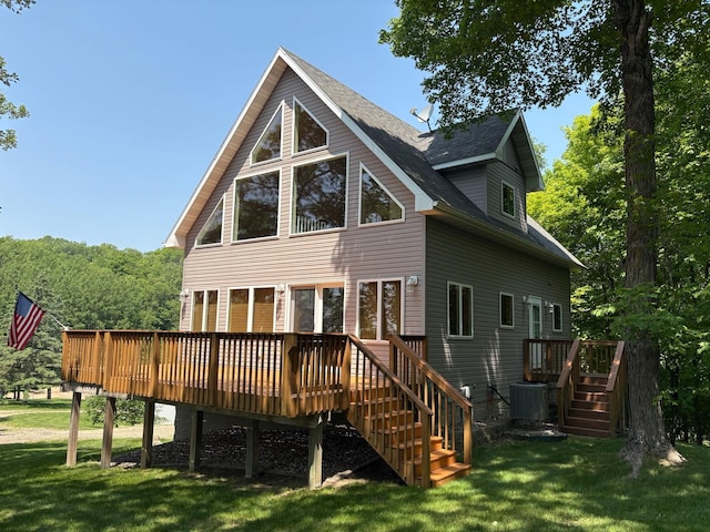 32813 Whispering Springs Loop, Erhard, MN 56534 - rear view of house with stairs, a deck, a yard, and a shingled roof