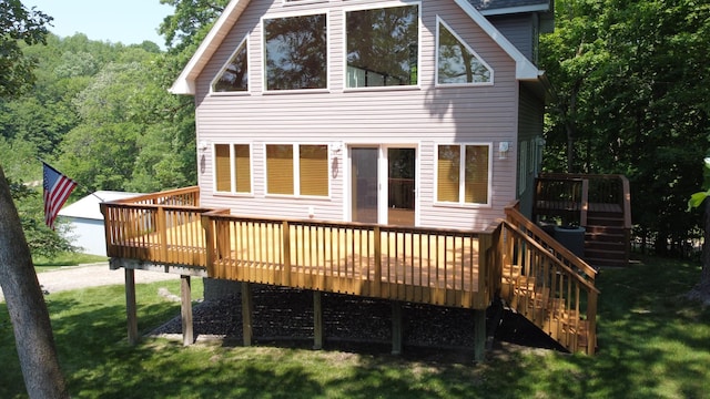32813 Whispering Springs Loop, Erhard, MN 56534 - rear view of property featuring stairs, a deck, a yard, and a view of trees
