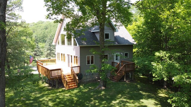 32813 Whispering Springs Loop, Erhard, MN 56534 - back of house featuring stairs, a deck, a yard, and roof with shingles